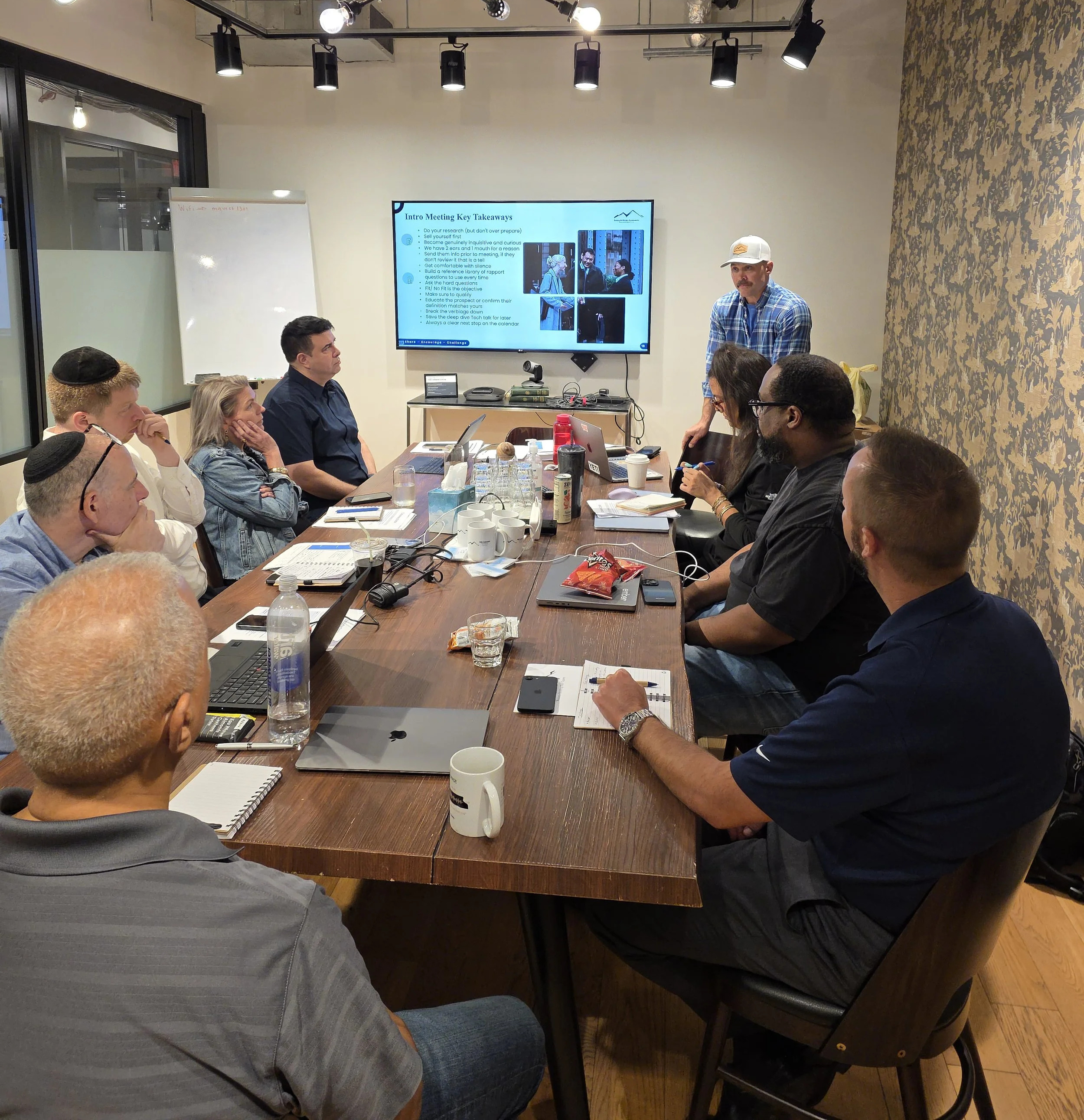 Benjamin Altman leading a sales training session